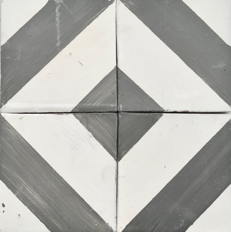 handpainted tiles in a grey and white pattern