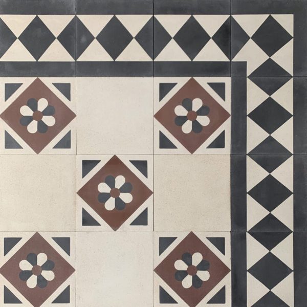 mönstrat cementgolv i svart, rött och vitt