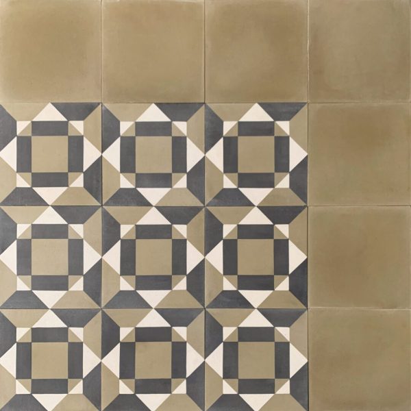 geometiskt mönstrat cementgolv med grön bårder