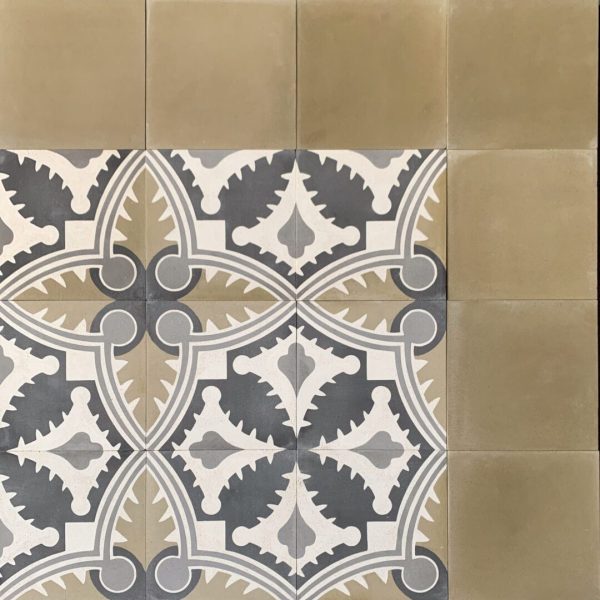 mönstrat cementgolv i svart, grönt och kräm