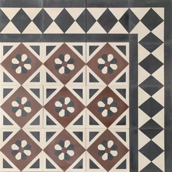 mönstrat cementgolv i svart, rött och vitt