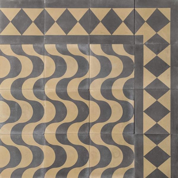 mönstrat cementgolv med vågor och romber