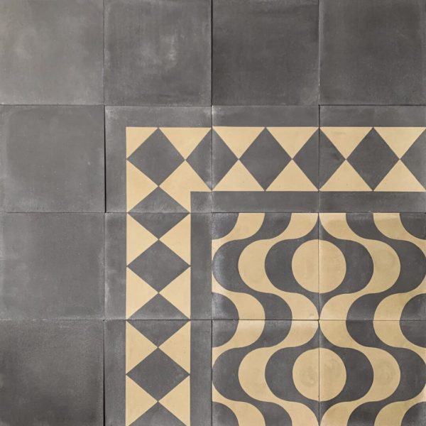 mönstrat cementgolv i olivgrönt och svart