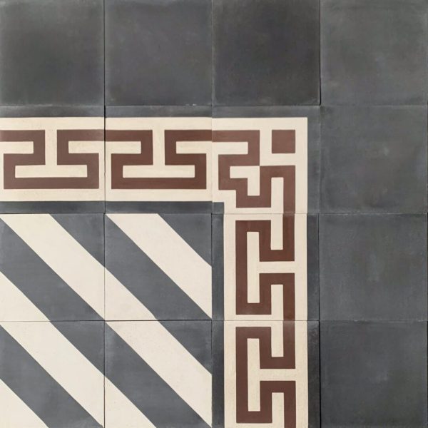 mönstrat cementgolv i kräm, rött och svart