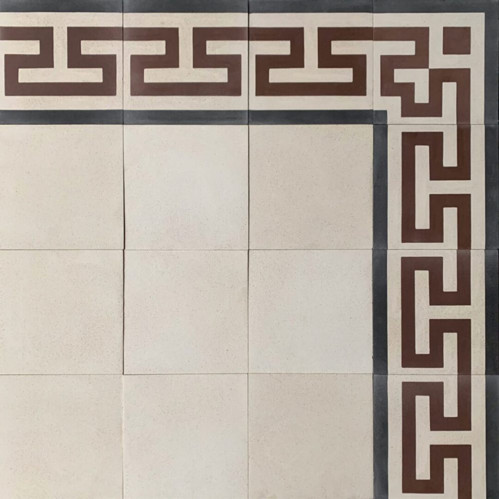 mönstrat cementgolv i kräm, rött och svart