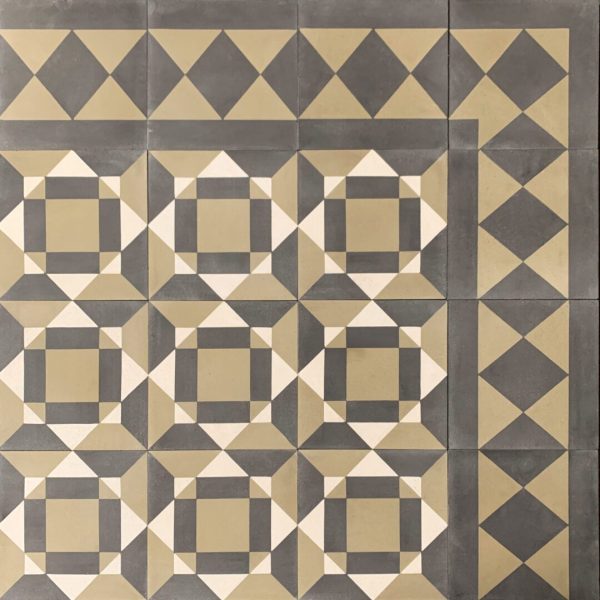 mönstrat cementgolv i svart, grönt och kräm