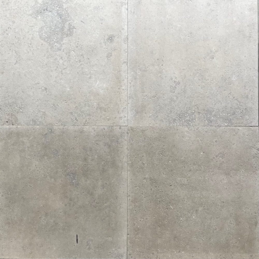 Jura-kalksten med en borstad yta i en varm grå nyans